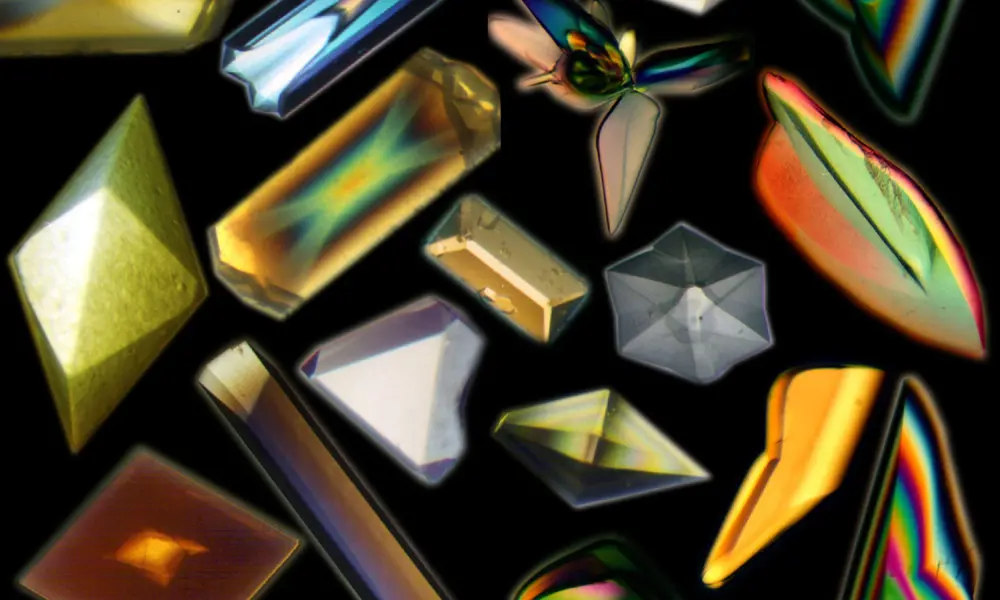 A collage of close ups of 16 crystals, all different shapes and colours due to polarised light.