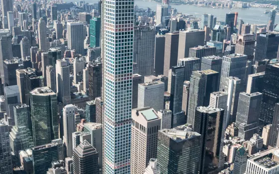 432 Park Avenue skyscraper towering above New York city's skyline. 