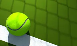 A bright green tennis ball against a dark green background