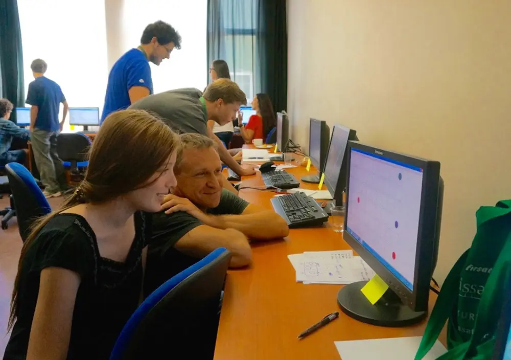 Professor Nick McKeown FREng with a female student looking at a computer screen.