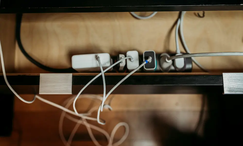 A group of chords plugged in to an adaptor. 