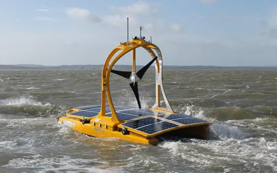 The C-Enduro in the ocean with land in the background.