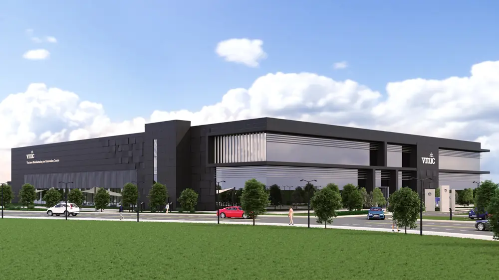 A computer generated depiction of a large vaccine manufacturing and innovation centre with a road and a pathway surrounding the building. 