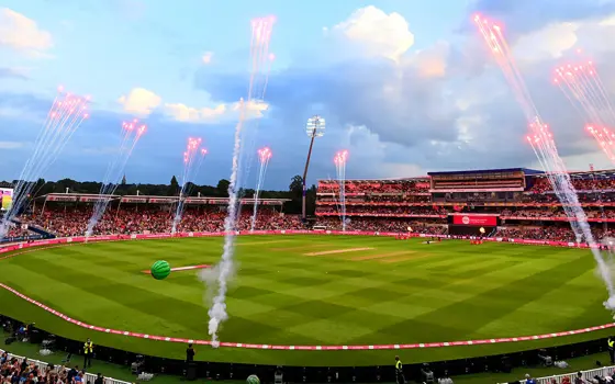 A photograph of a football field with fireworks.