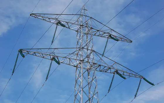 An overhead pylon with power lines. 
