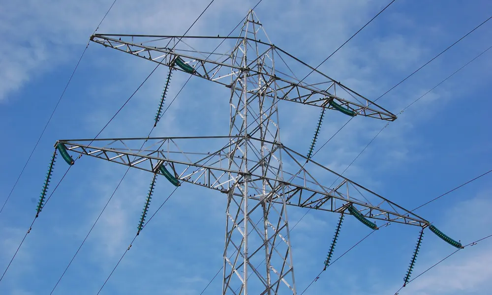 An overhead pylon with power lines. 