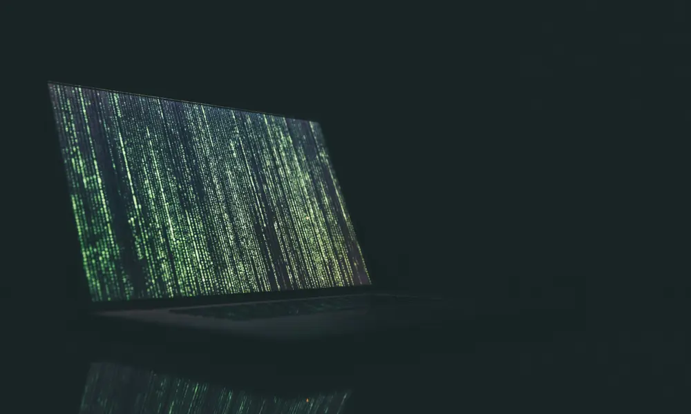 A laptop with green dotted vertical lines taking up the screen.