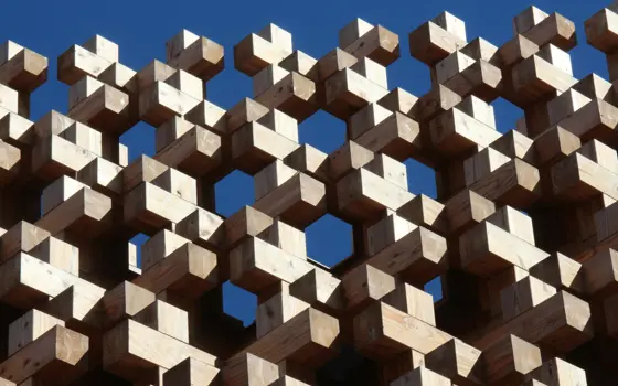 A structure of wooden blocks placed on top of each other. 