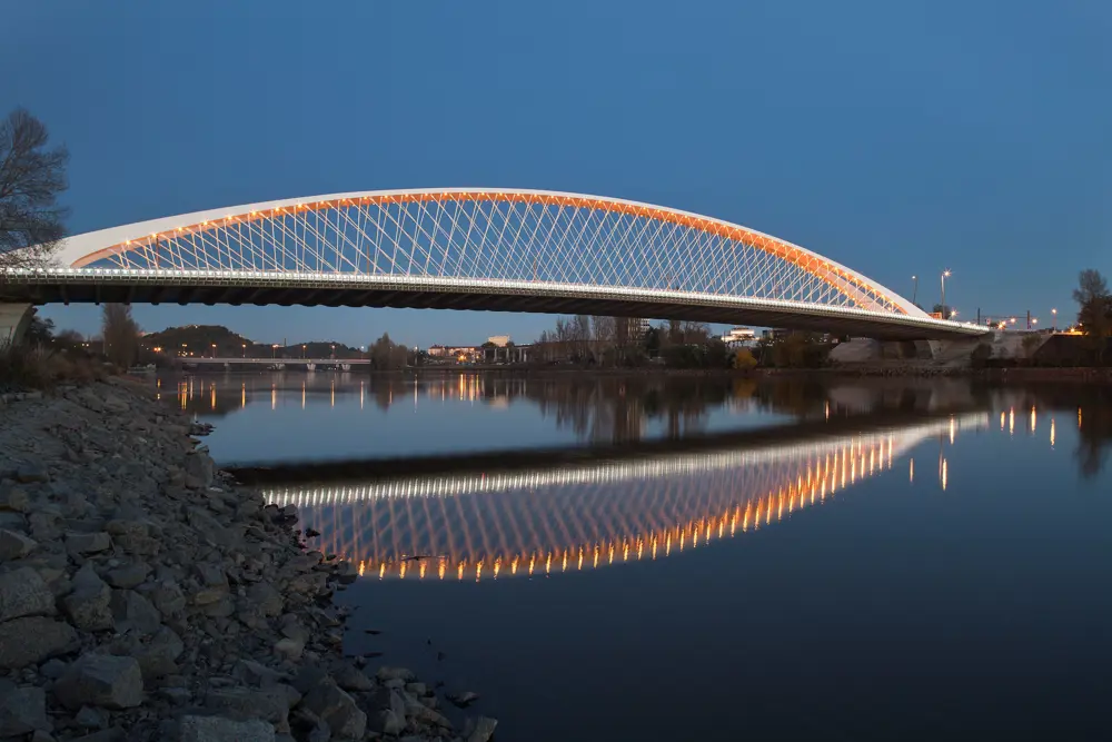 Troja bridge lit up at night.